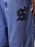 Calça Jeans Folgada Com Distintivos